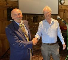 Reg Markham receiving the President's Chain of Office from Harvey Dodgson